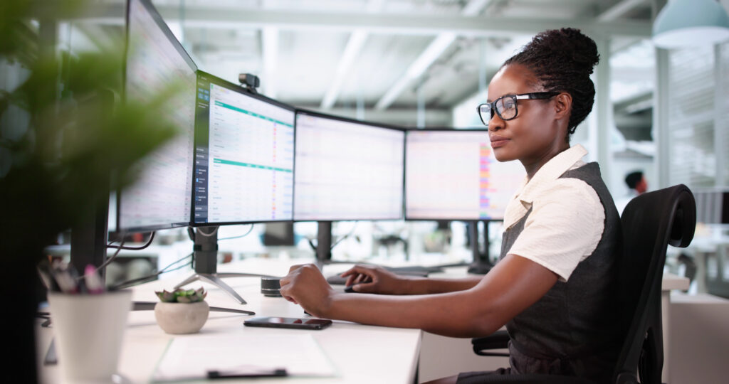 Businesswoman Using Spreadsheet To Investigate Medical Billing Data Coding Errors