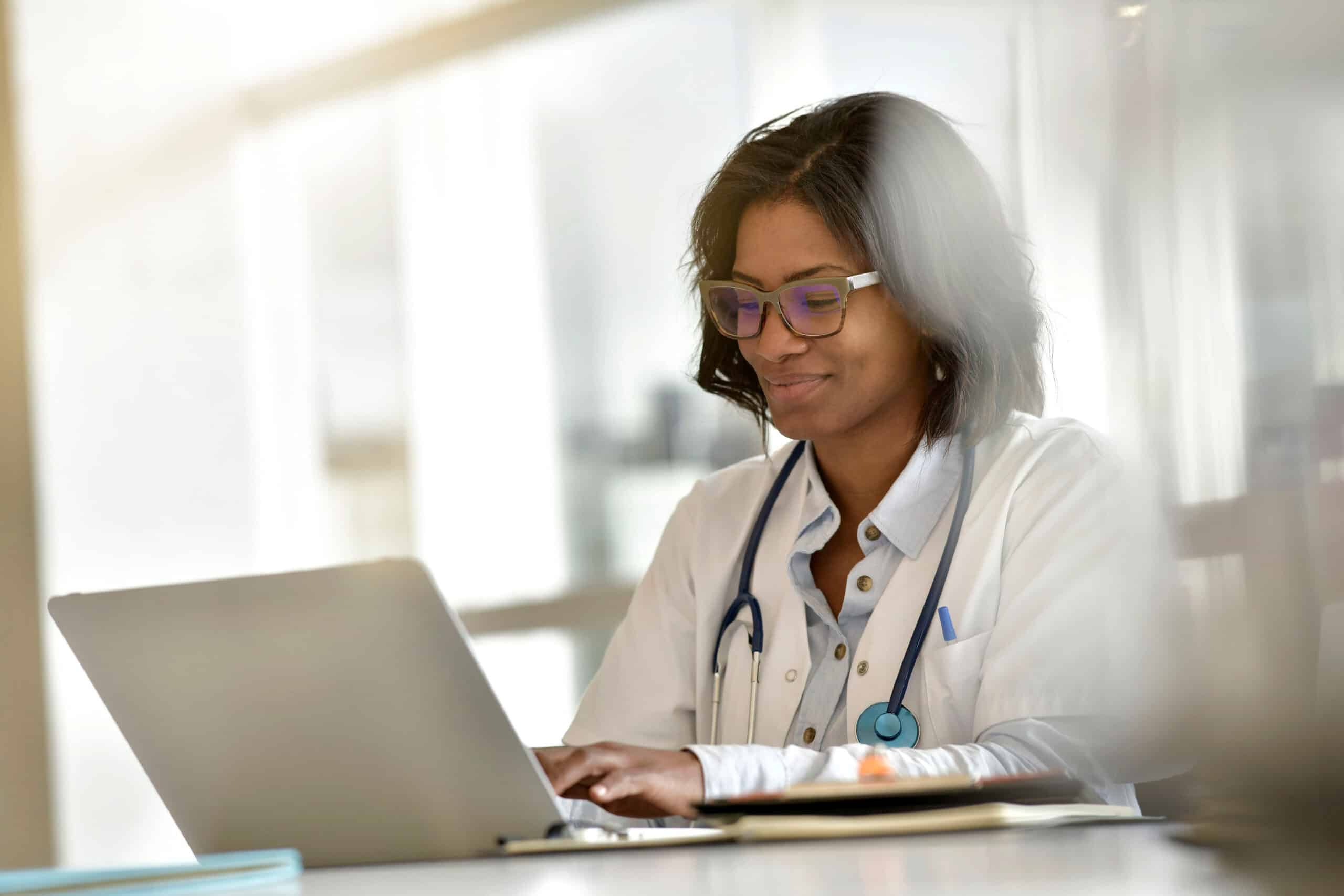 Physician reviewing electronic health record dashboard