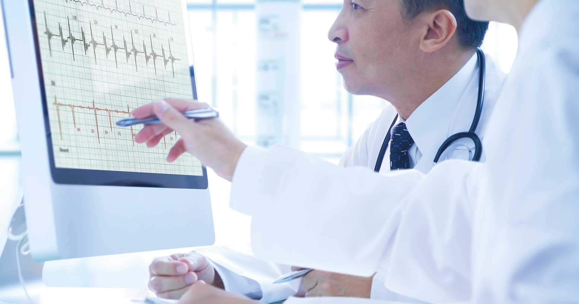 Healthcare team analyzing patient analytics dashboard