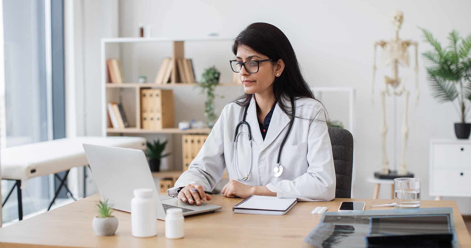 Medical staff using practice management software with key features