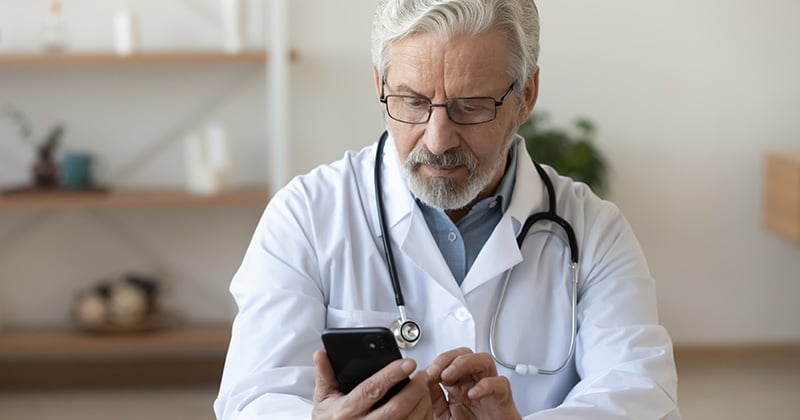 Medical staff using practice management software with key features