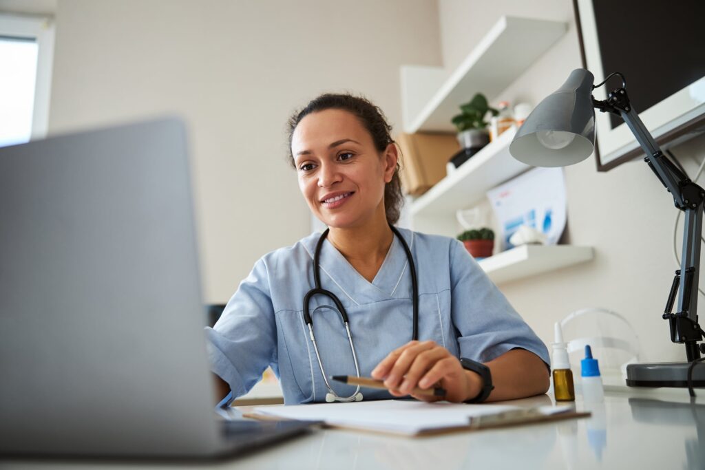 Medical coder updating patient medical records with the latest coding information.