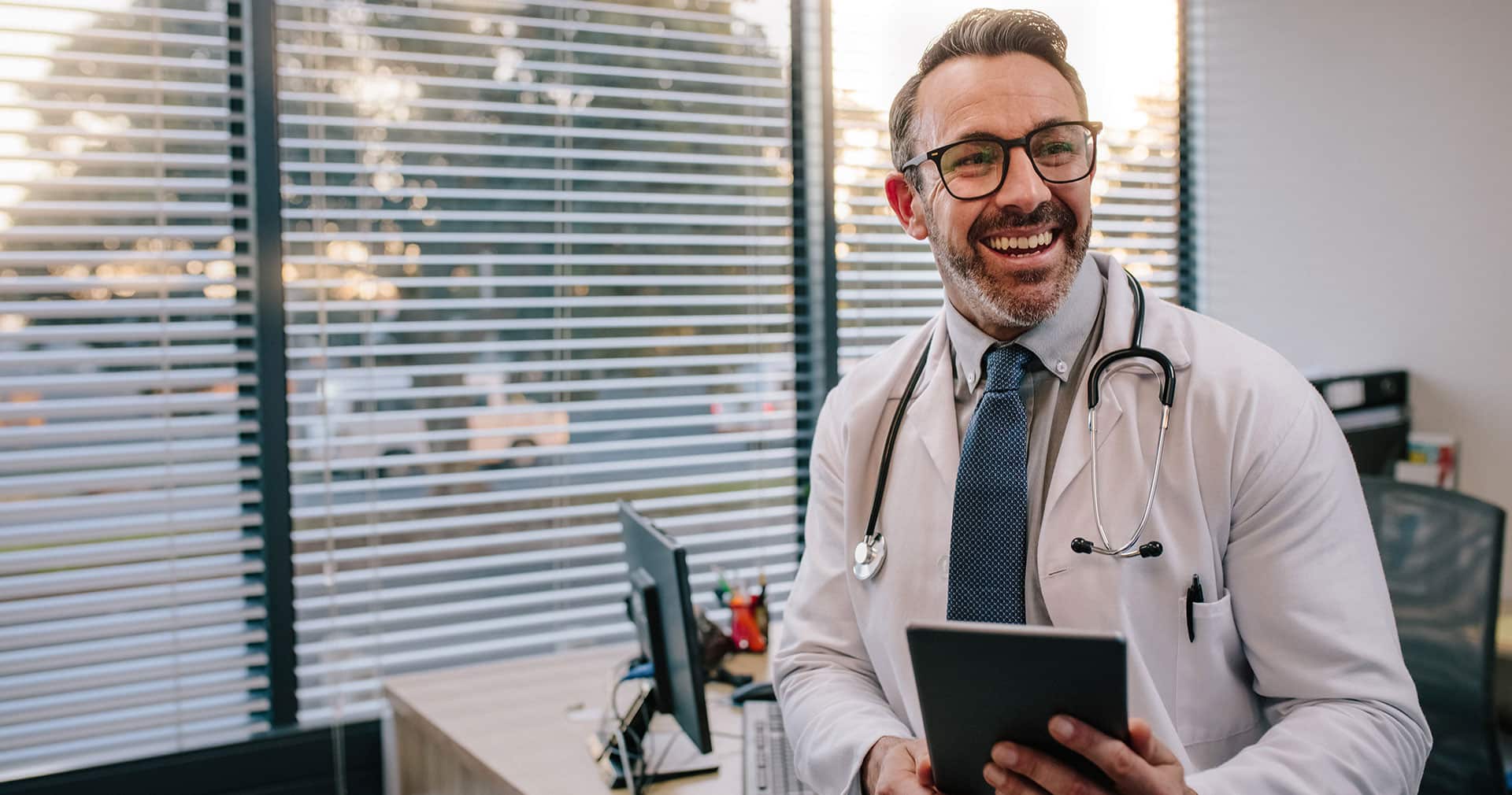 Doctor using practice management software.